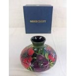 MOORCROFT VASE WITH ANEMONE PATTERN.