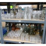 A GOOD SELECTION OF CRYSTAL AND SMOKED GLASS TO INCLUDE DECANTERS, WINE GLASSES ETC,
