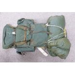 LARGE ARMY STYLE GREEN RUCKSACK WITH METAL FRAME, BOTTLE, HAZARD SUIT,