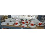 WEDGWOOD 'CORN POPPY' DINNER AND TEA SERVICE A SUSIE COOPER DESIGN