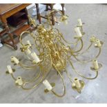 20TH CENTURY BRASS 21 BRANCH CHANDELIER Condition Report: some arms are bent.