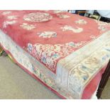 KAYAN 100% WOOL PILE PINK AND CREAM RUG WITH FLORAL DECORATION.