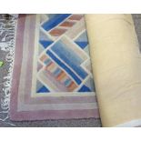 100% WOOL PINK AND MULTICOLOURED CHINESE RUG WITH LABEL TO UNDERSIDE 180 X 290CM