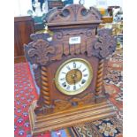 OAK CASED MANTLE CLOCK WITH CARVED DECORATION