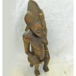 SEATED SENUFO FEMALE FIGURE WITH MULTI LOBED COIFFURE AND SCARIFICATION'S TO FACE AND BODY - 53CM