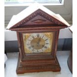 LATE 19TH CENTURY OAK MANTLE CLOCK WITH BRASS & SILVERED DIAL ON BRACKET SUPPORTS - 38CM TALL