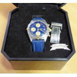 A BREITLING STAINLESS STEEL AND GOLD AUTOMATIC CALENDAR CHRONOGRAPH WRISTWATCH THE BLUE DIAL WITH 3