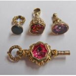 3 VICTORIAN FOBS & VICTORIAN WATCH KEY Condition Report: These are gold plated.