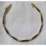 18CT YELLOW GOLD 9 SECTION CHANNEL SET SAPPHIRE AND DIAMOND BRACELET Condition Report: