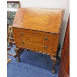 20TH CENTURY WALNUT BUREAU WITH FALL FRONT OVER 2 DRAWERS ON BALL & CLAW SUPPORTS