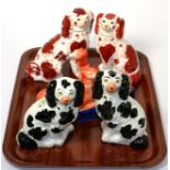 Two pairs of Staffordshire pottery dog ornaments and a similar pair of greyhound inkwells (6)