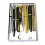 A small group of pens including Waterman's and Parker, some with nibs stamped '14K'