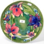 A Walter Moorcroft orchid and spring flowers dish