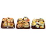 Three trays of Noritake orange and yellow ground wares including trinket dishes, vases, dressing