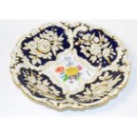 A 20th century Meissen bowl, relief moulded with painted floral vignette and gilt