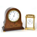 An inlaid mantel timepiece and a brass carriage timepiece (2)