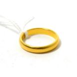 A 22ct gold band ring, finger size R1/26.54g