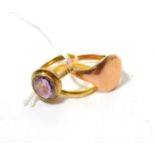 A 22ct gold band ring finger size O, a signet ring, finger size Q and a 9ct gold amethyst ring,