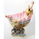 A large Capodimonte centrepiece in the form of a merman and sea horses surrounding a shell,