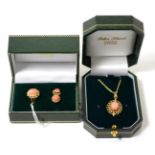 A 9ct gold coral set pendant on chain and a 9ct gold ring, finger size M and a pair of matching stud