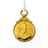 A 9ct gold sport medallion, golf interest 9g