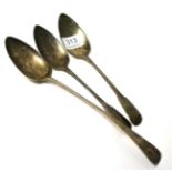 A Georgian silver spoon and a pair of silver serving spoons (3) 7.7 ozt