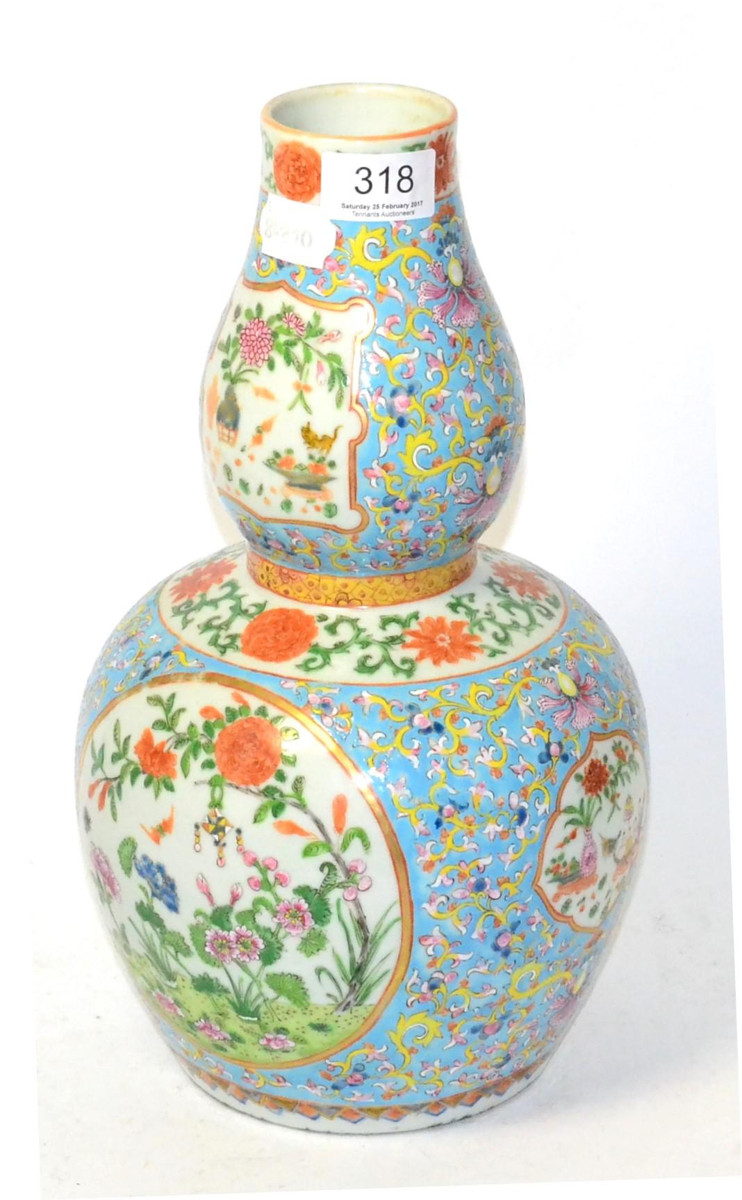 A Chinese double gourd vase with floral decoration Minor firing faults around base rim. Otherwise