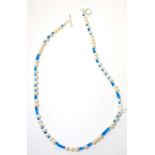 A cultured pearl and apatite bead necklace and earring suite, round cultured pearls spaced by groups