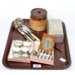 A silver cigarette box, silver mounted sprigged tobacco jar, silver mounted burr walnut ink blotter,