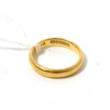 An 18ct gold band ring, finger size N4.9g