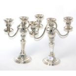 A pair of plated three branch candelabra