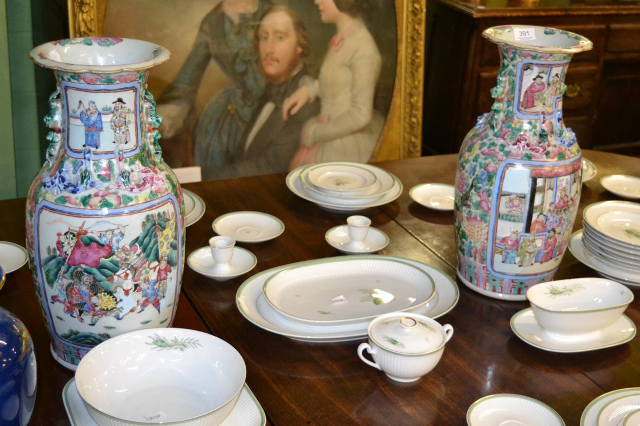 A pair of late 19th century Chinese famille rose vases (restored) Both vases extensively restored.