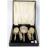 A cased silver mounted dressing table set