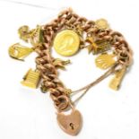 A charm bracelet, curb links stamped '9CT', with an assortment of attached charms stamped '14', '