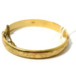 A 9ct gold bangle 11.1 grams