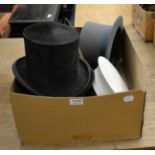 A group of hats including two bowlers and two top hats etc