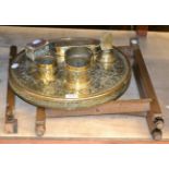 An Eastern brass top folding table, a stand, an ashtray, a matchbox holder, two bowls and a box