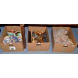 Three boxes of Continental ceramics and animal sculptures, shells, etc