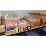 A quantity of watch parts including watch movements, glasses, balance wheels, watch part catalogues,