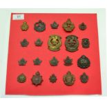 A Collection of Twenty First World War Canadian Cap and Collar Badges, in bronze and brass,