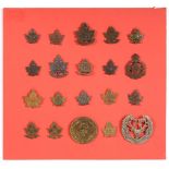 A Collection of Twenty First World War Canadian Cap and Collar Badges, in bronze, brass and white