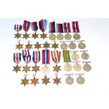 A Collection of Thirty Two Single Second World War Medals, comprising nine 1939-45 Stars, an Italy