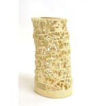 A Cantonese Ivory Tusk Vase, 19th century, intricately carved and pierced with figures amongst