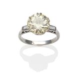 A Diamond Solitaire Ring, an old cut diamond in a white six double-claw setting, to angular