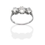 A Diamond Three Stone Ring, three graduated round brilliant cut diamonds in white claw settings