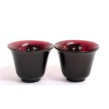 A Pair of Peking Manganese Glass Tea Bowls, Qing Dynasty, of ovoid form with slightly everted
