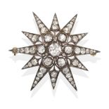 A Diamond Star Brooch, an old cut diamond within a border of smaller old cut diamonds to twelve