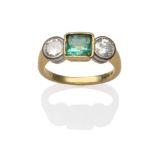 An 18 Carat Gold Emerald and Diamond Three Stone Ring, an emerald-cut emerald in a yellow rubbed