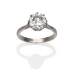 A Diamond Solitaire Ring, a round brilliant cut diamond in a white claw setting, to knife edge
