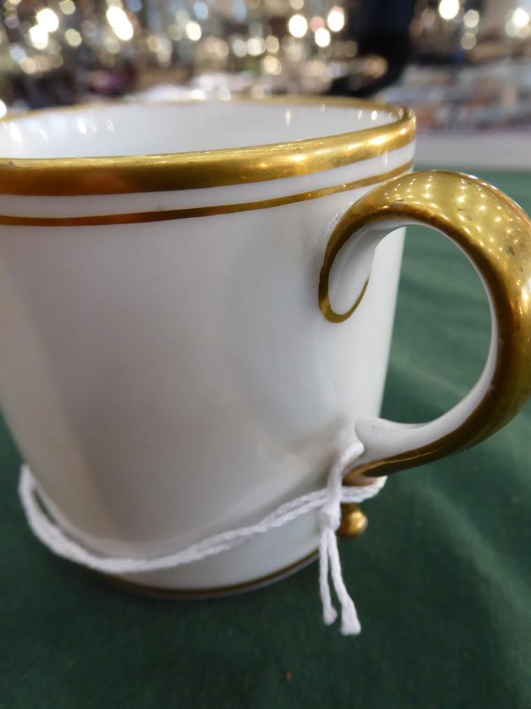 A Paris Porcelain Coffee Can and Saucer, circa 1790, painted with river landscapes, within gilt - Image 10 of 12